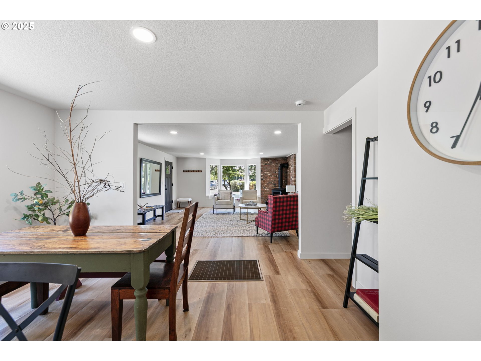 1938 7th Street Springfield, OR 97477 - Photo 23 of 48 a view of a dining room with furniture and wooden floor