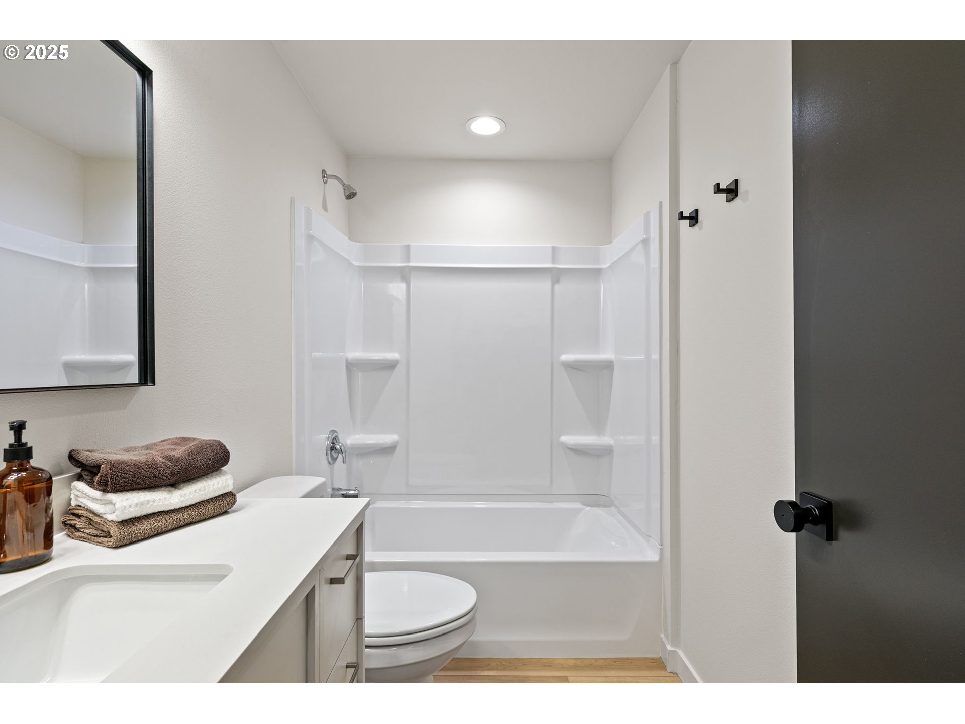1938 7th Street Springfield, OR 97477 - Photo 29 of 48 a bathroom with a sink toilet vanity and tub