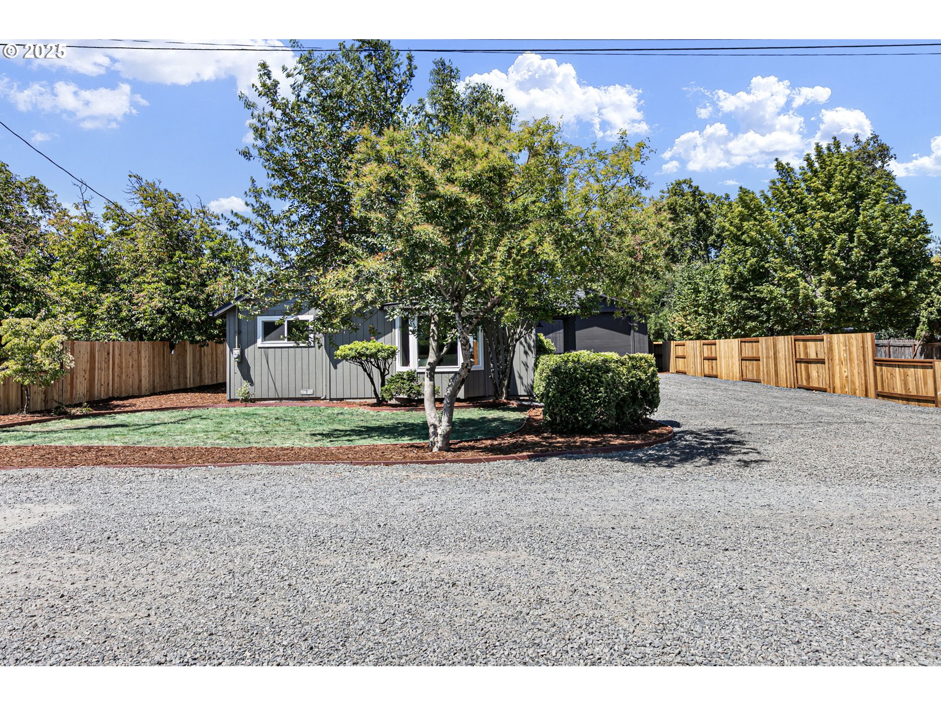 1938 7th Street Springfield, OR 97477 - Photo 37 of 48 a backyard of a house with lots of green space