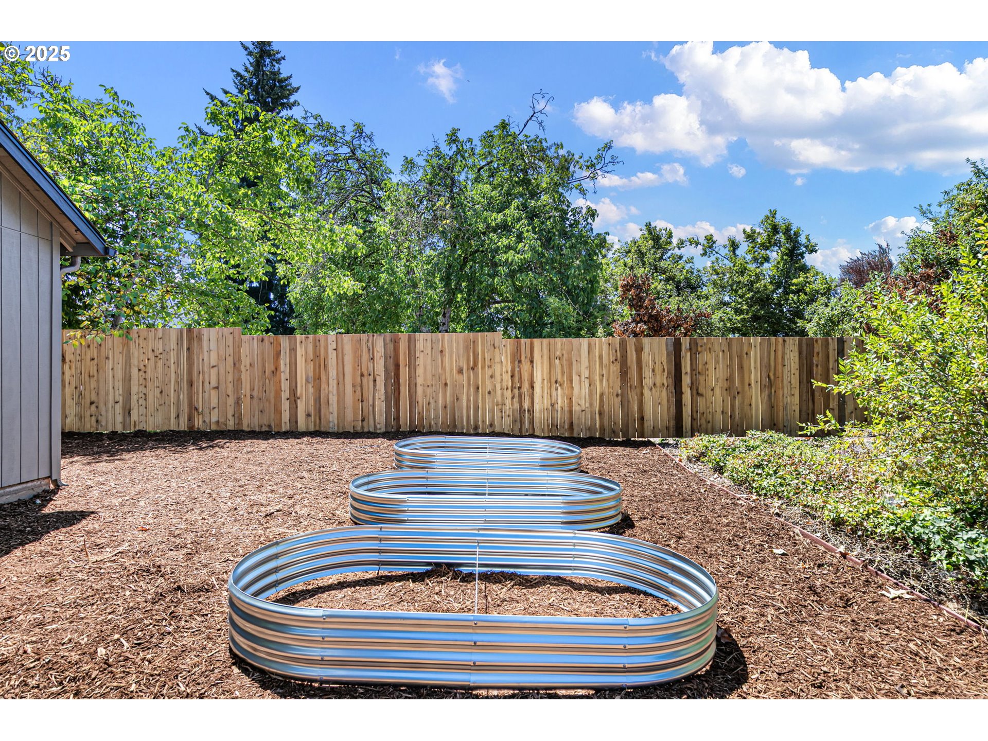 1938 7th Street Springfield, OR 97477 - Photo 43 of 48 a backyard of a house with yard fire pit and outdoor seating