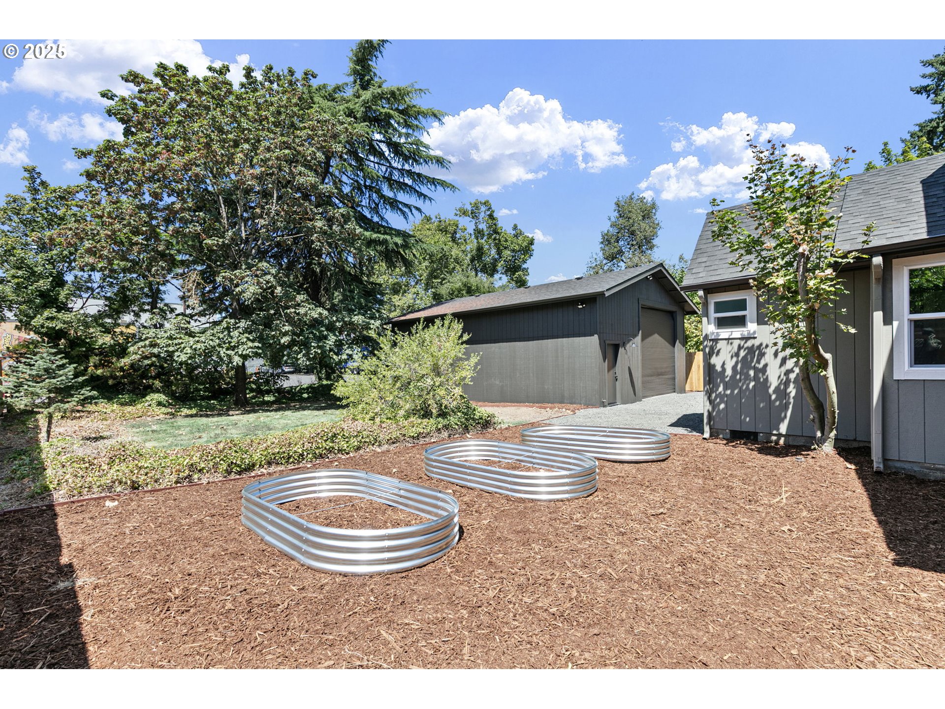 1938 7th Street Springfield, OR 97477 - Photo 47 of 48 a view of a house with backyard and sitting area