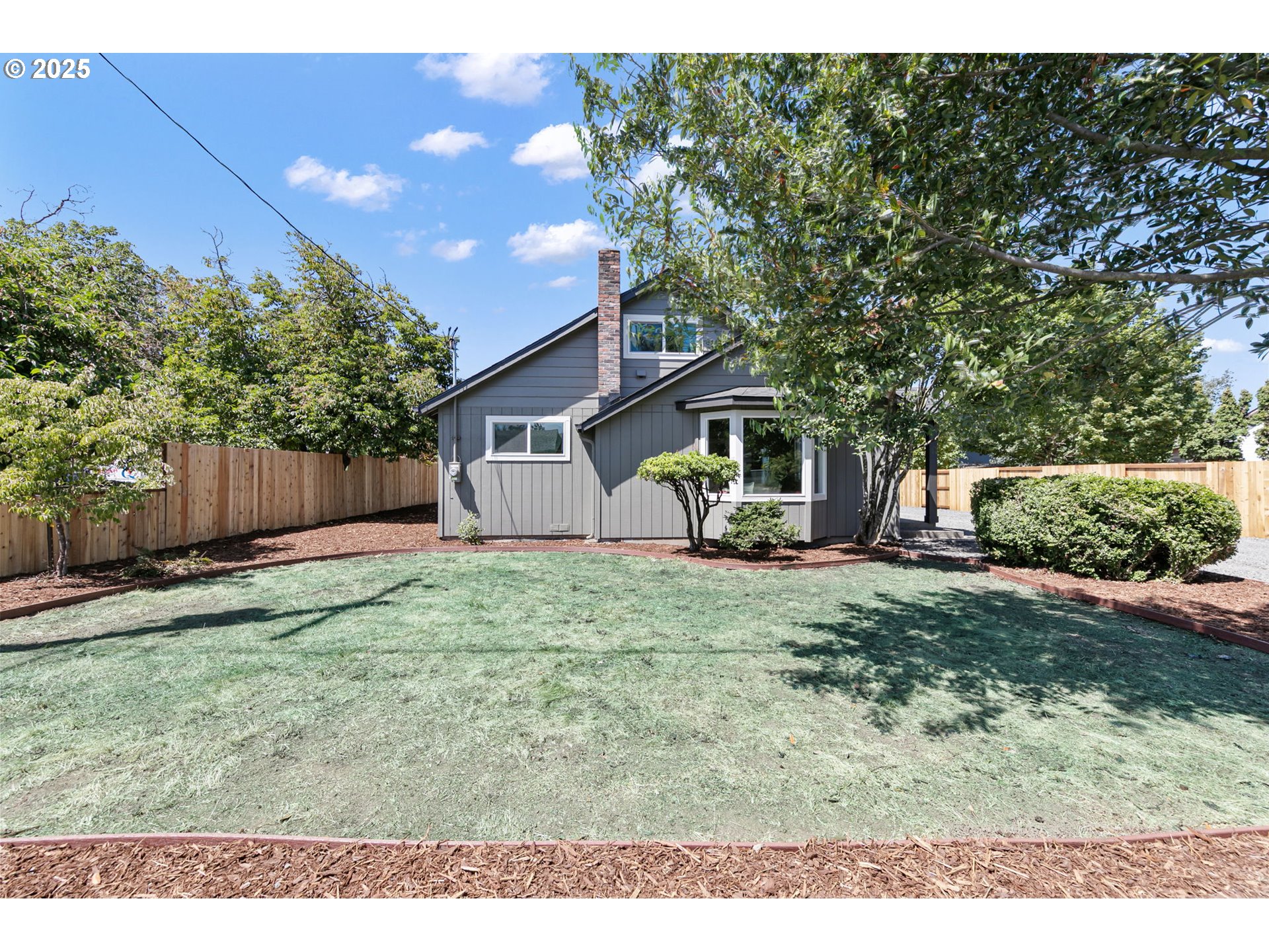 1938 7th Street Springfield, OR 97477 - Photo 48 of 48 a backyard of a house with table and chairs