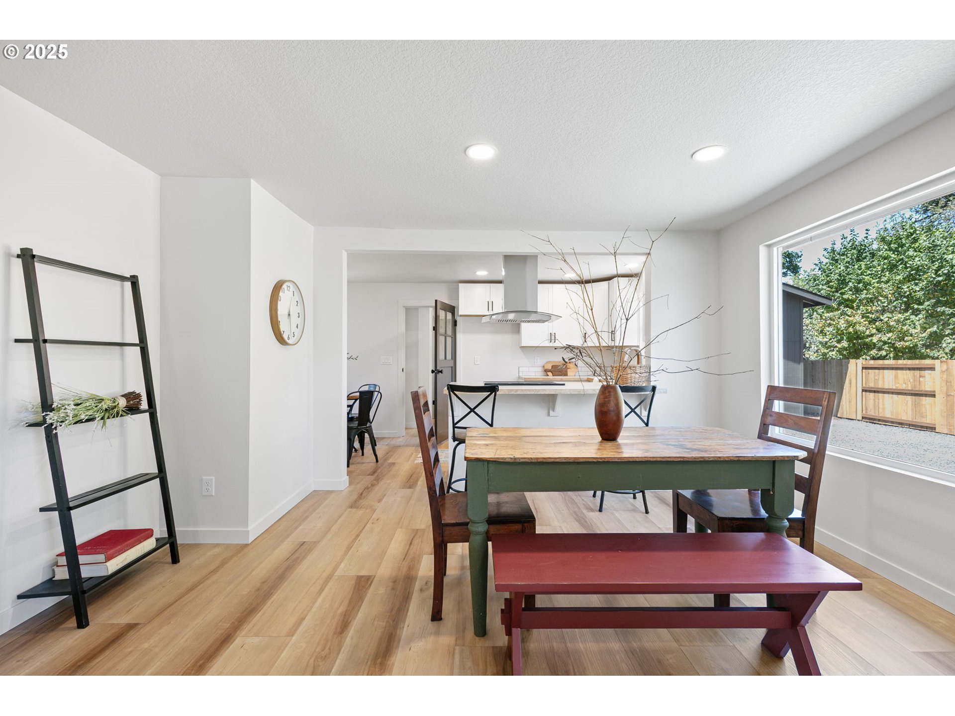 1938 7th Street Springfield, OR 97477 - Photo 10 of 48 a view of a dining room with furniture and a wooden floor