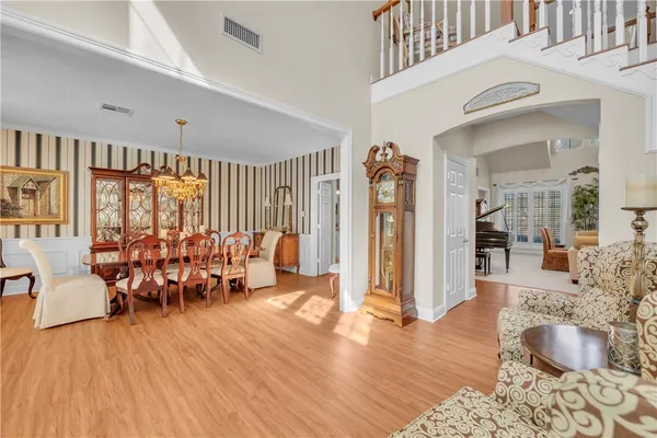 a living room with furniture fireplace and a table