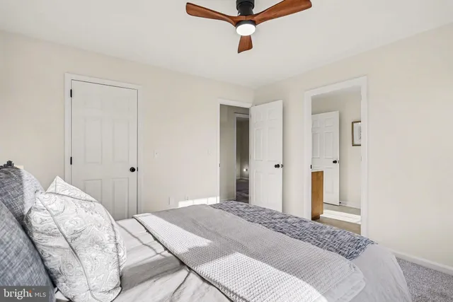 a bedroom with a bed and a dresser