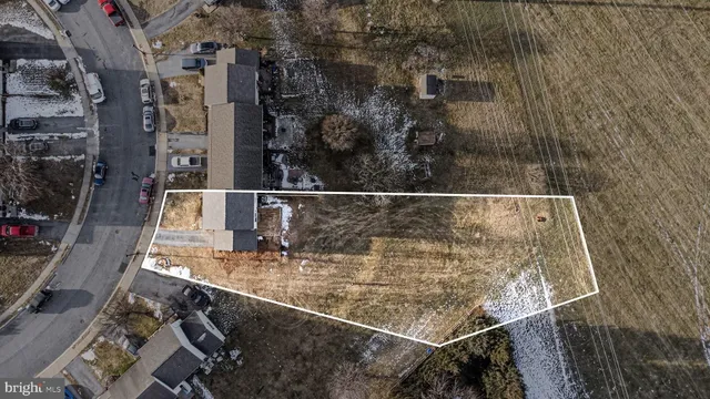 a front view of a house with a fence