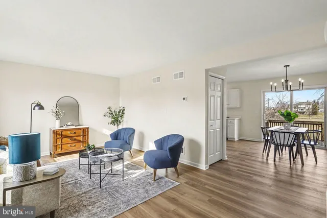 a workspace with furniture window and wooden floor