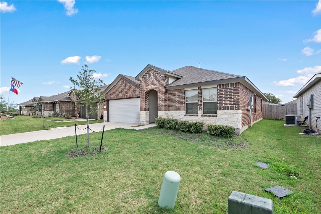 2413 Mulligan Lane Navasota, TX 77868 - Photo 2 of 6 a house view with a garden space