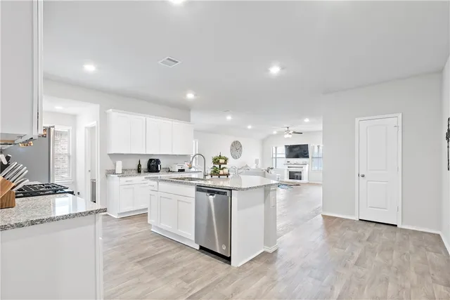 a spacious bedroom with a bed and a window