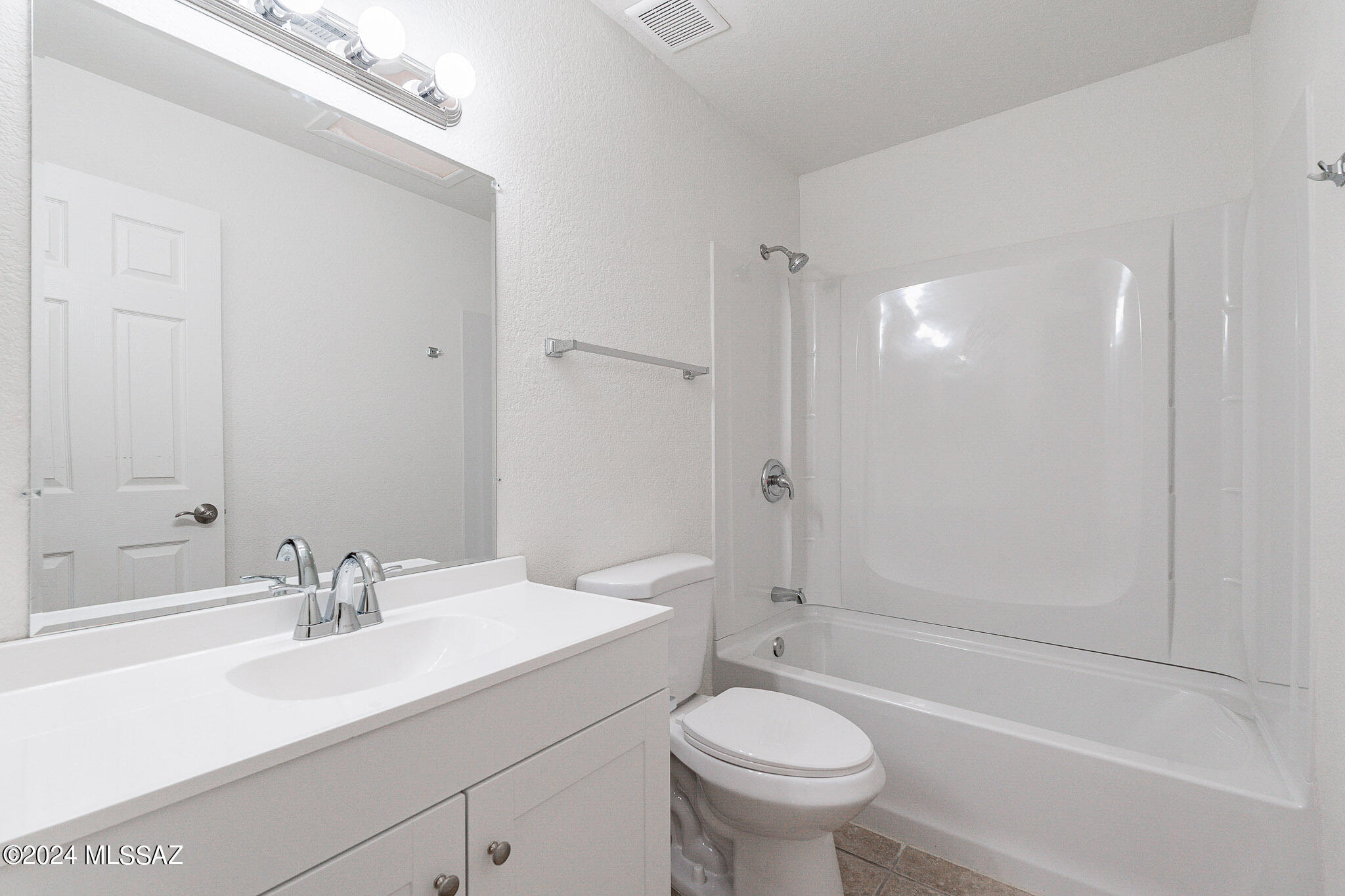 2690 West Sunset Road Tucson, AZ 85741 - Photo 17 of 33 a bathroom with a sink toilet and shower