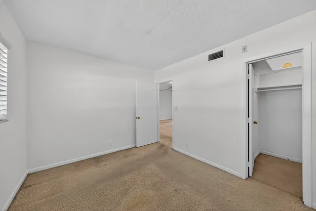 a front view of a house with parking space