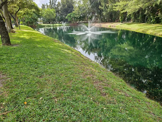 an aerial view of residential houses with outdoor space and street view