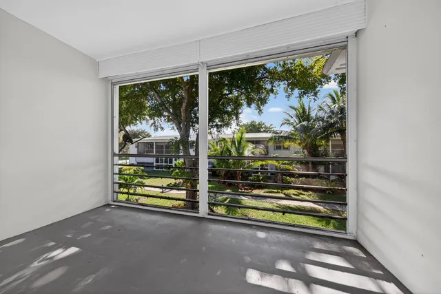a view of backyard with deck and outdoor seating