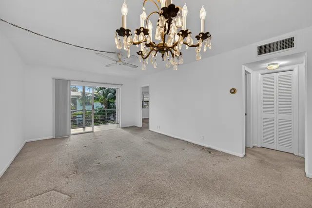 a view of a chandelier in an empty room