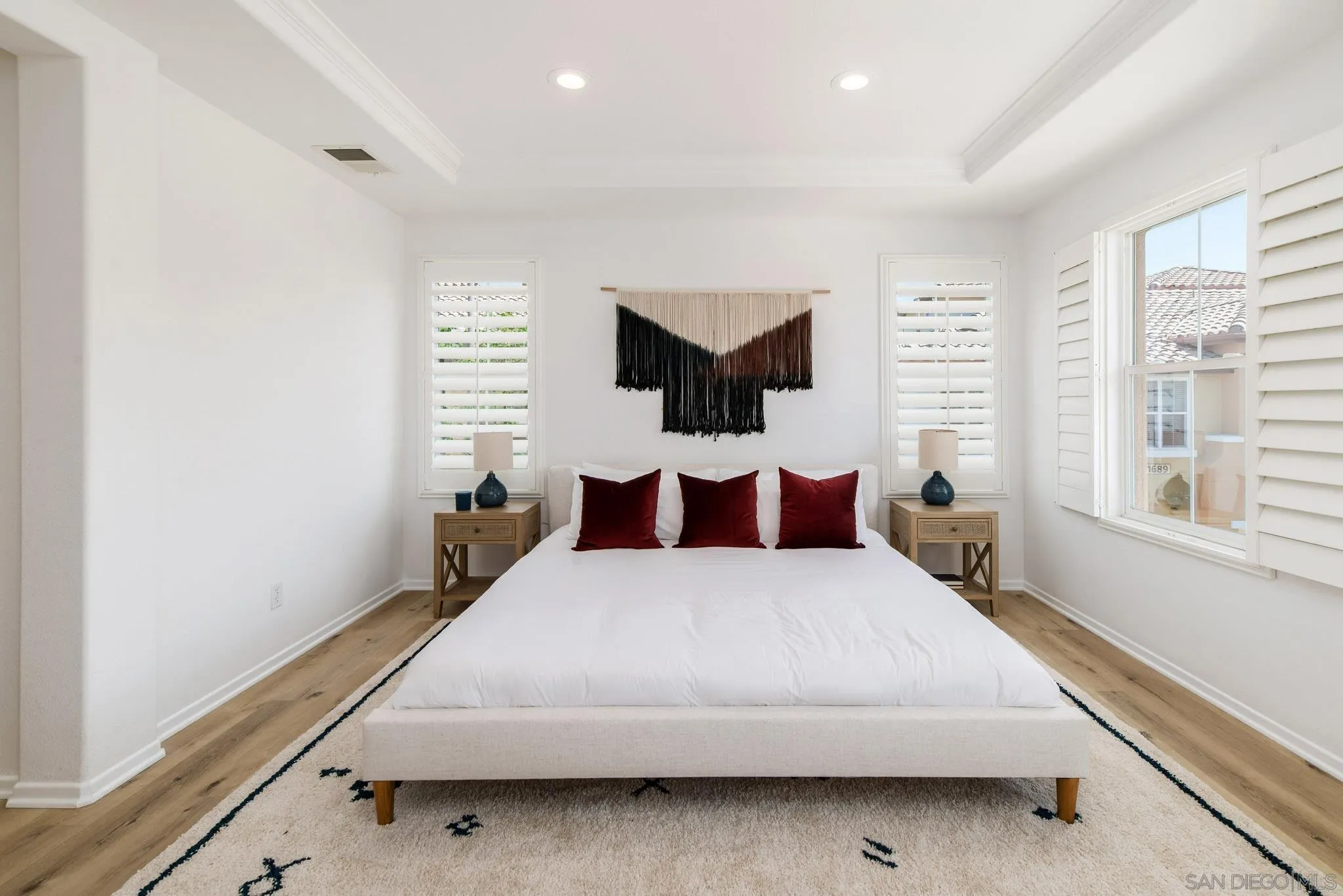 1694 Avery Road San Marcos, CA 92078 - Photo 15 of 22 a large bed sitting in a bedroom next to a window