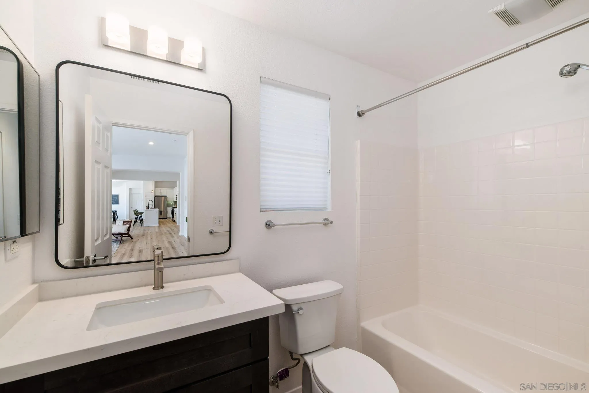 1694 Avery Road San Marcos, CA 92078 - Photo 21 of 22 a bathroom with a sink a toilet and mirror