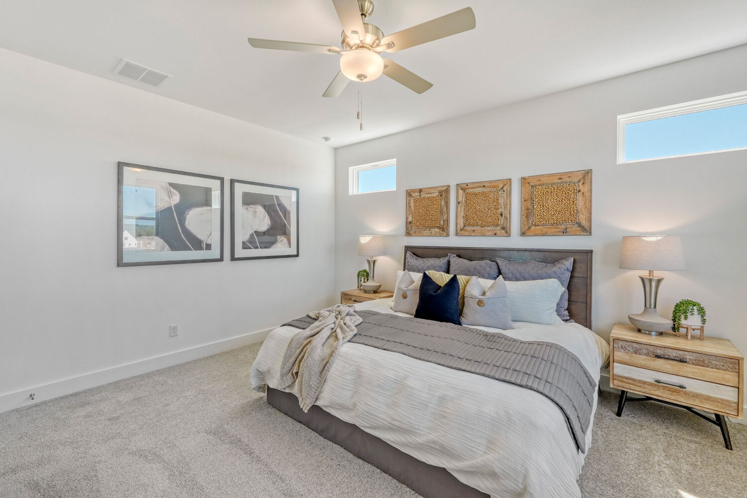 141 Sincere Drive Kyle, TX 78640 - Photo 16 of 23 a bedroom with a bed and a chandelier