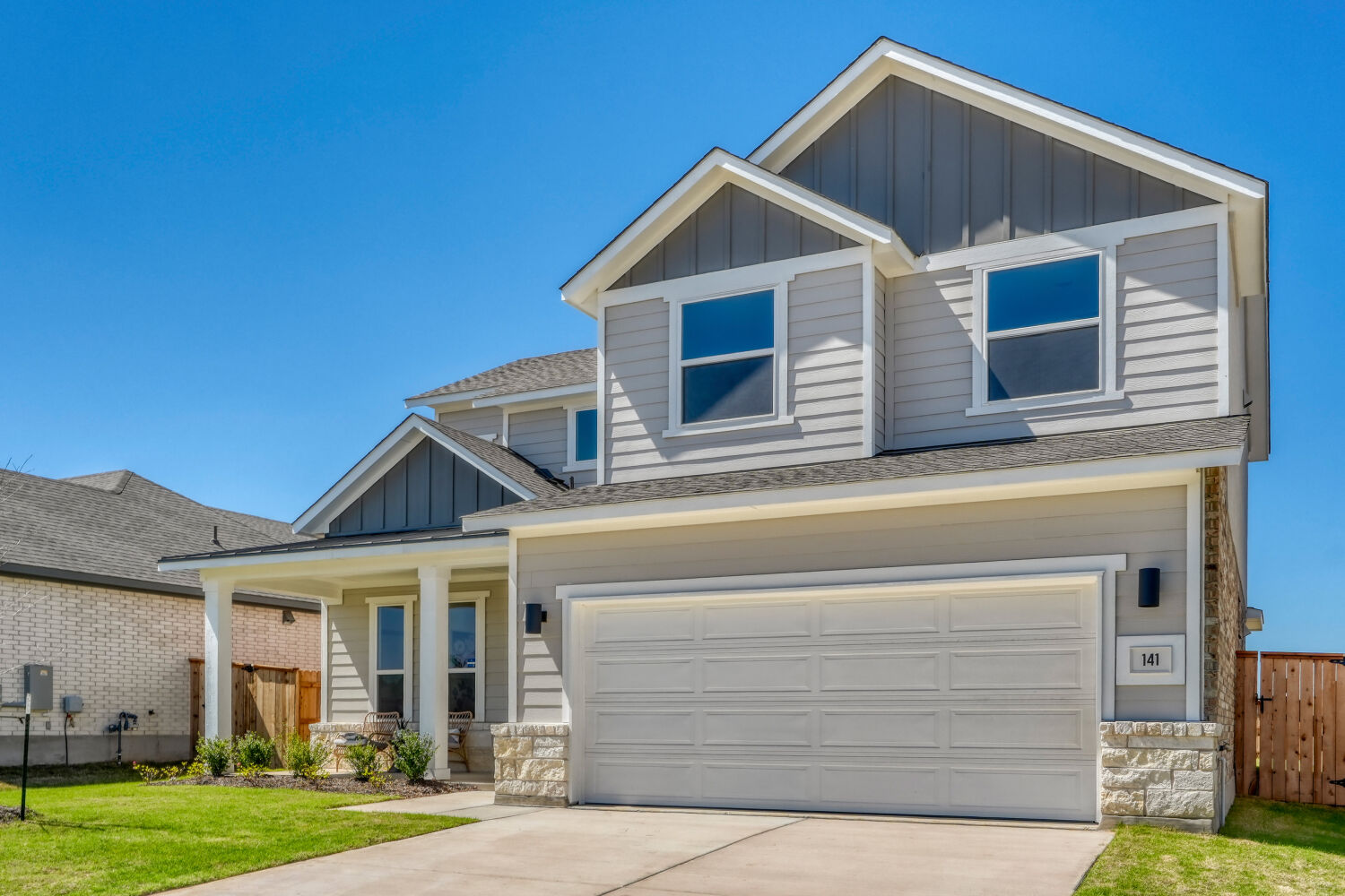 141 Sincere Drive Kyle, TX 78640 - Photo 2 of 23 a front view of a house with garden