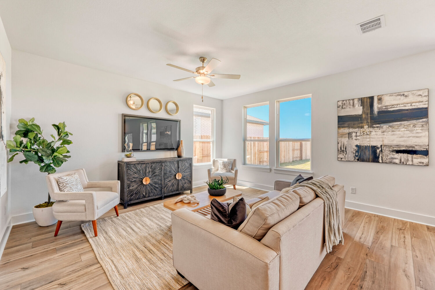 141 Sincere Drive Kyle, TX 78640 - Photo 5 of 23 a living room with furniture a fireplace and a flat screen tv