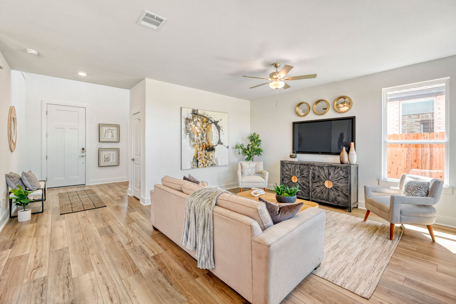 141 Sincere Drive Kyle, TX 78640 - Photo 6 of 23 a living room with furniture and a flat screen tv