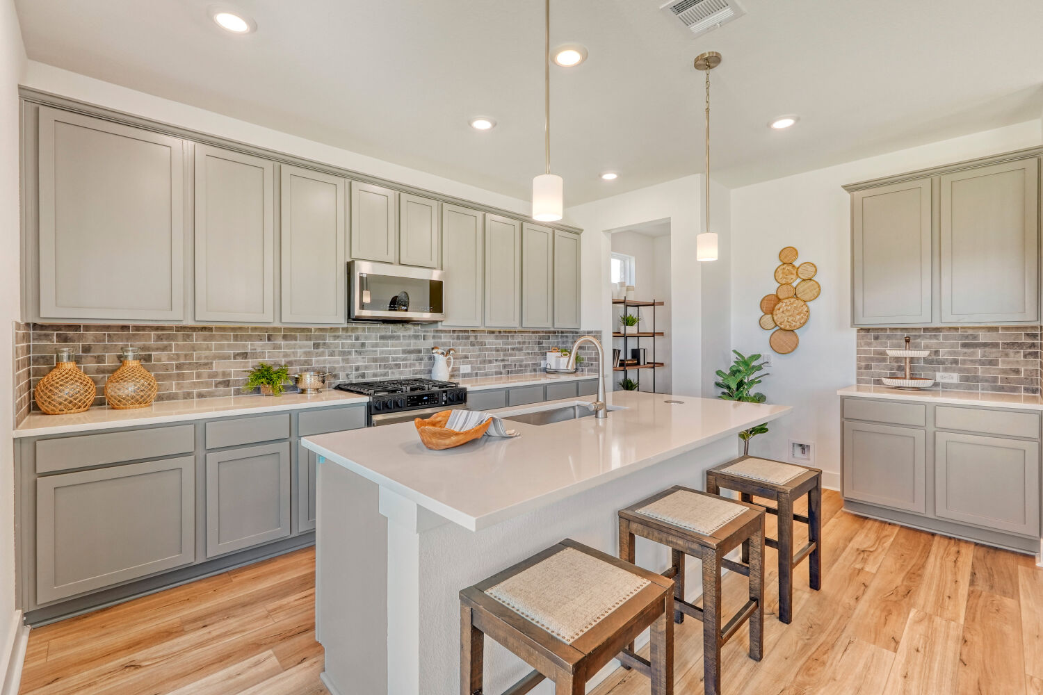 141 Sincere Drive Kyle, TX 78640 - Photo 10 of 23 a kitchen with a sink cabinets and wooden floor