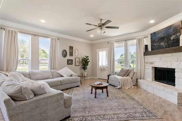 a living room with furniture and a fireplace