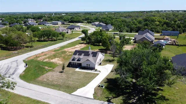a view of a swimming pool with a yard and mountain view