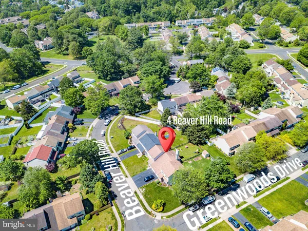 an aerial view of residential house with outdoor space and swimming pool