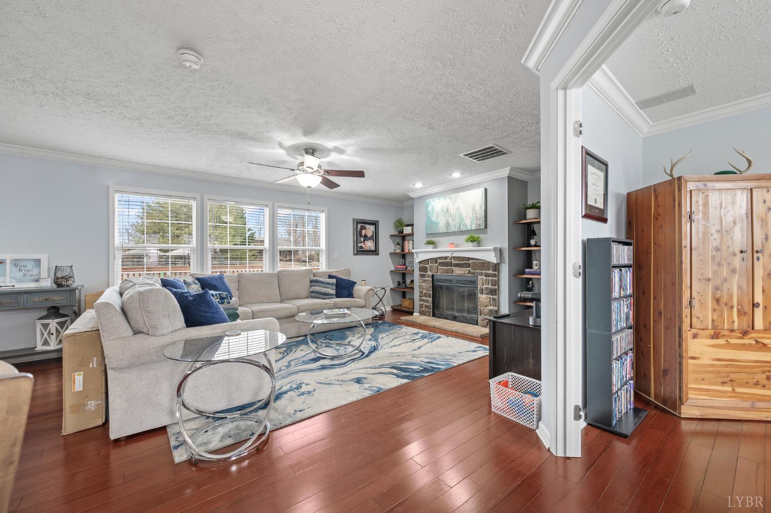 1689 Otter Hill Road Bedford, VA 24523 - Photo 22 of 45 a living room with furniture fireplace and wooden floor