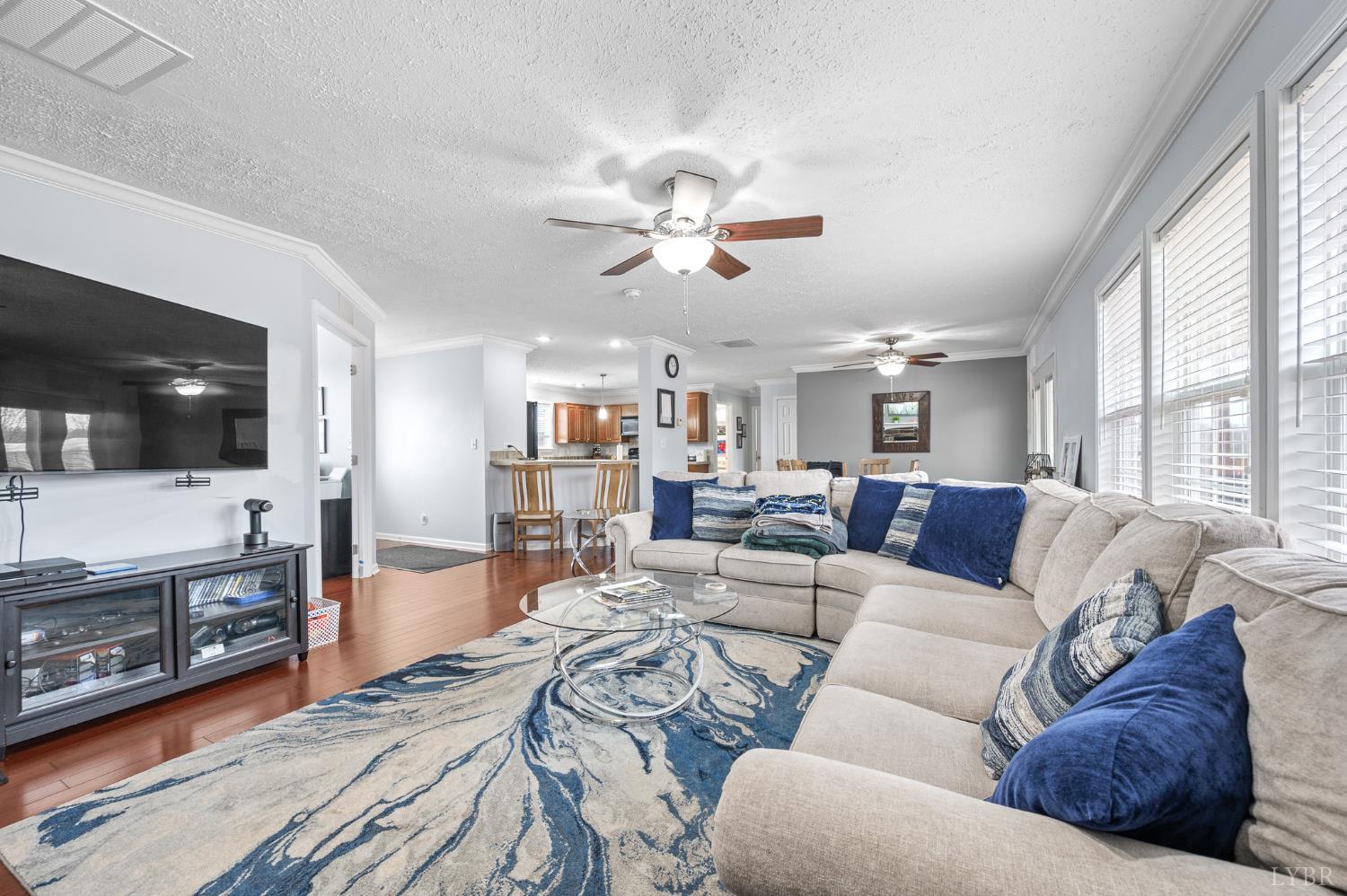 1689 Otter Hill Road Bedford, VA 24523 - Photo 26 of 45 a living room with furniture ceiling fan and a flat screen tv