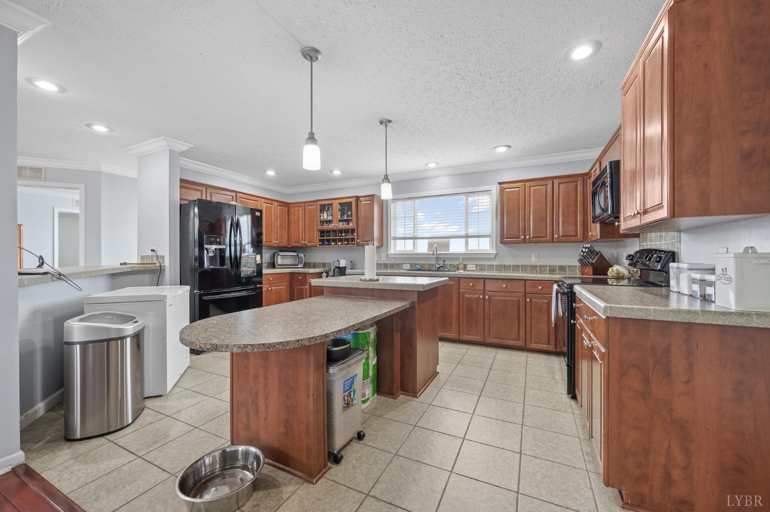 1689 Otter Hill Road Bedford, VA 24523 - Photo 29 of 45 a kitchen with stainless steel appliances granite countertop a sink counter space cabinets and a view of kitchen