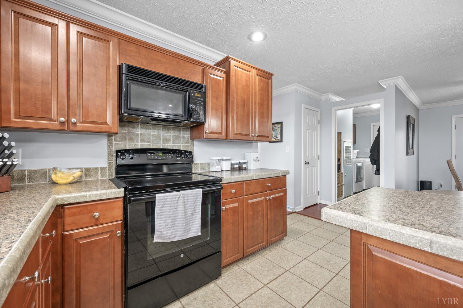 1689 Otter Hill Road Bedford, VA 24523 - Photo 31 of 45 a kitchen with stainless steel appliances granite countertop a stove a sink and a microwave