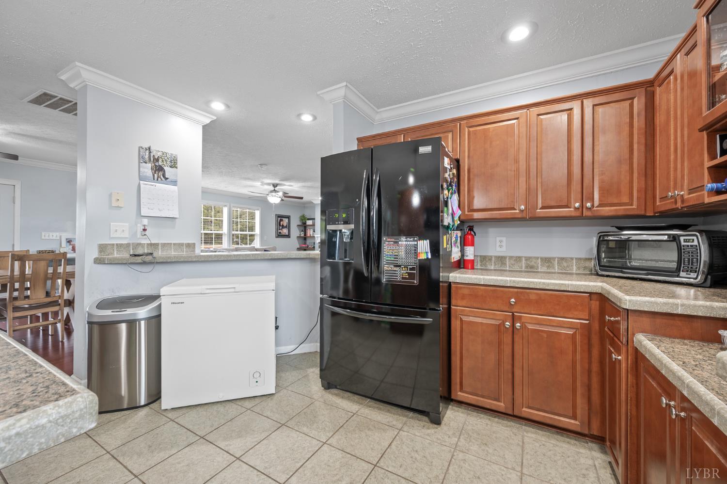 1689 Otter Hill Road Bedford, VA 24523 - Photo 34 of 45 a kitchen with a refrigerator sink and cabinets