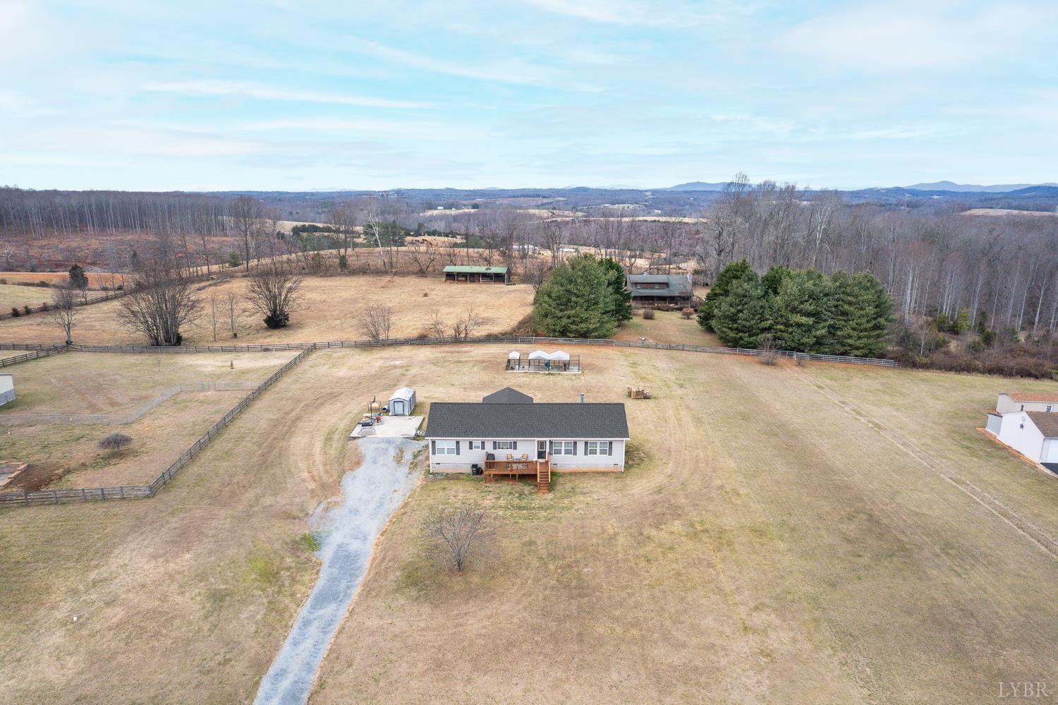 1689 Otter Hill Road Bedford, VA 24523 - Photo 8 of 45 an aerial view of a house with a yard and lake view