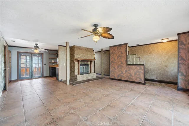 a large kitchen with stainless steel appliances granite countertop a stove and a refrigerator