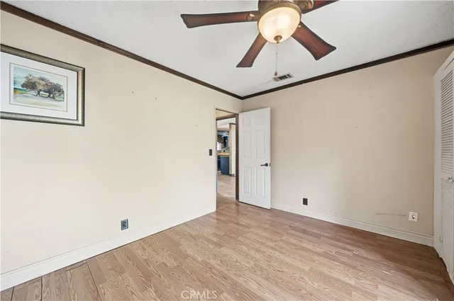 a bathroom with a granite countertop toilet sink and a mirror