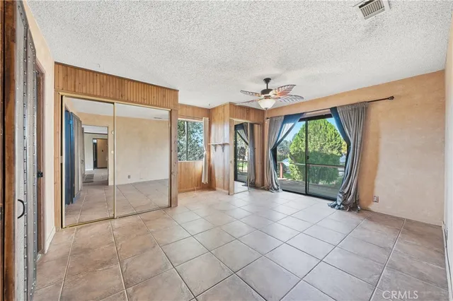 a view of an empty room with a balcony