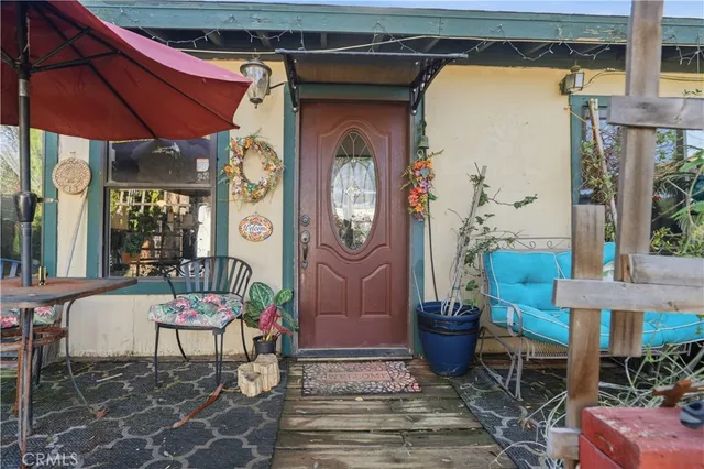 a view of an entryway with wooden floor