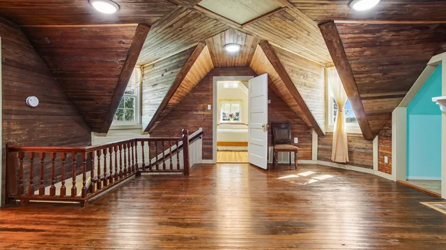 a view of an entryway with wooden floor