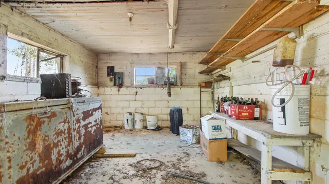 a view of a roof deck with couches and wooden floor