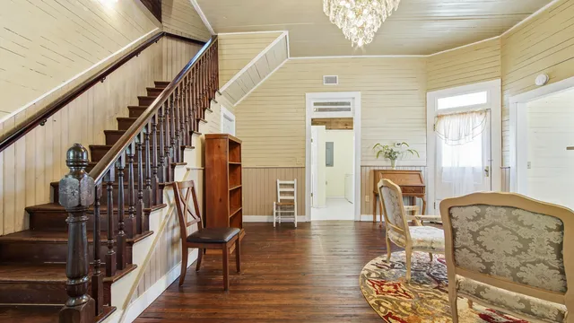 a view of an entryway with wooden floor