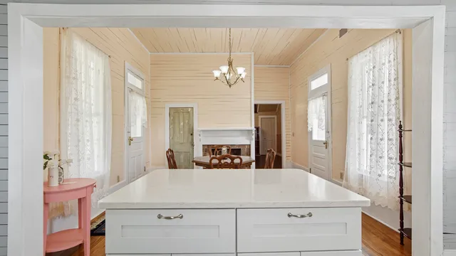 a bathroom with a sink a large mirror and a shower