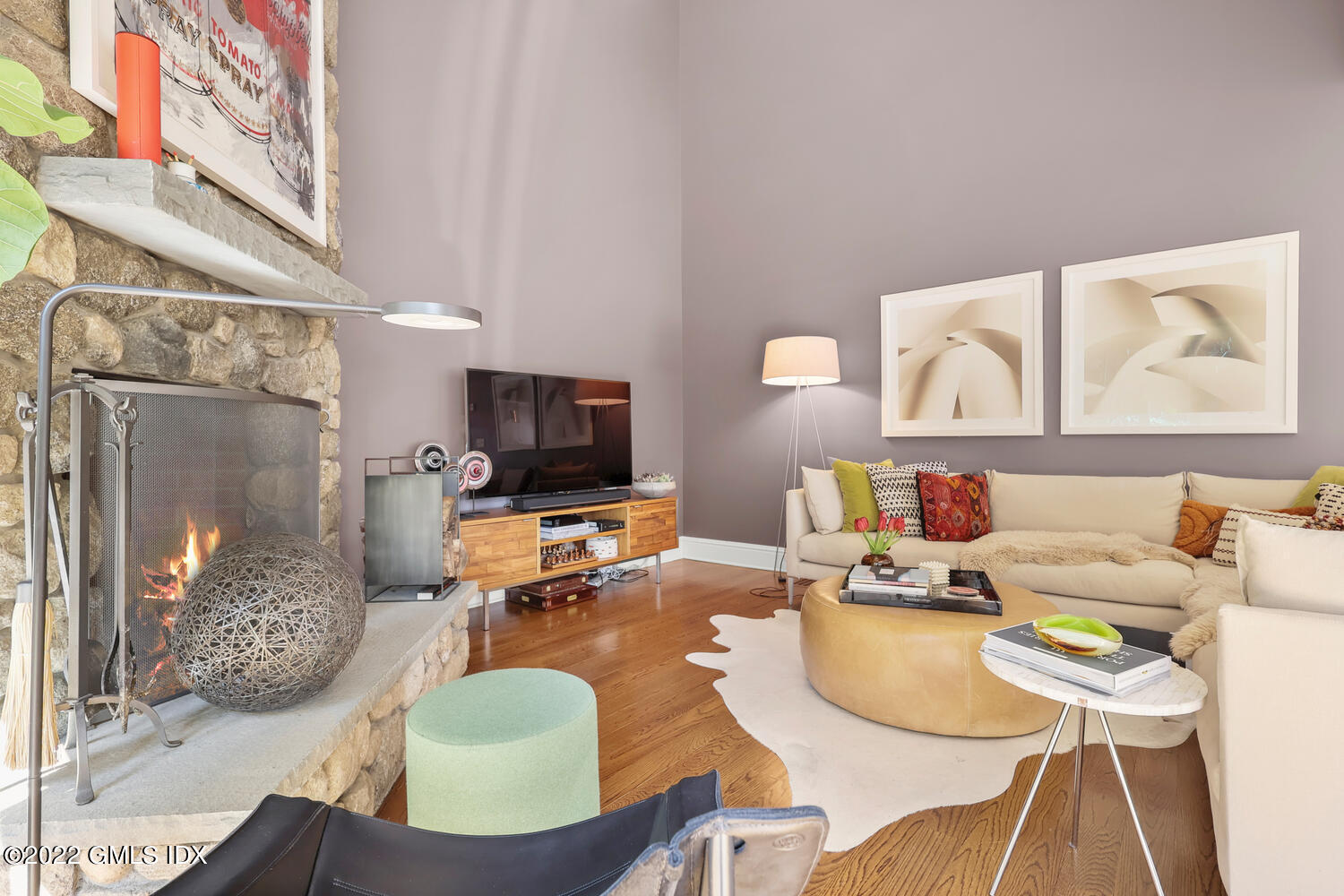318 Valley Road Cos Cob, CT 06807 - Photo 13 of 33 a living room with furniture a flat screen tv and a table