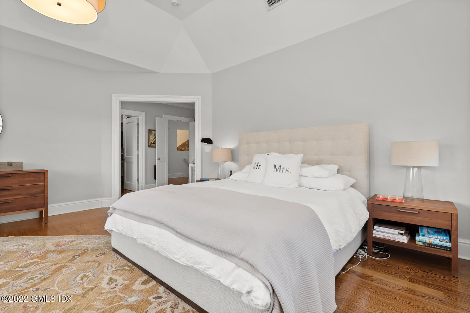 318 Valley Road Cos Cob, CT 06807 - Photo 16 of 33 a bedroom with a bed and a lamp on dresser
