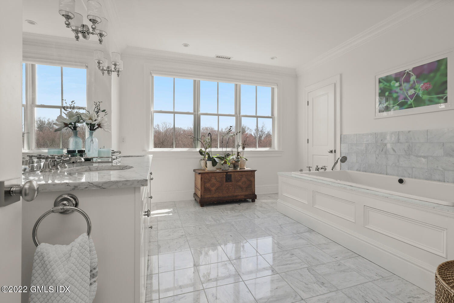 318 Valley Road Cos Cob, CT 06807 - Photo 17 of 33 a bathroom with a granite countertop bathtub a sink and a window