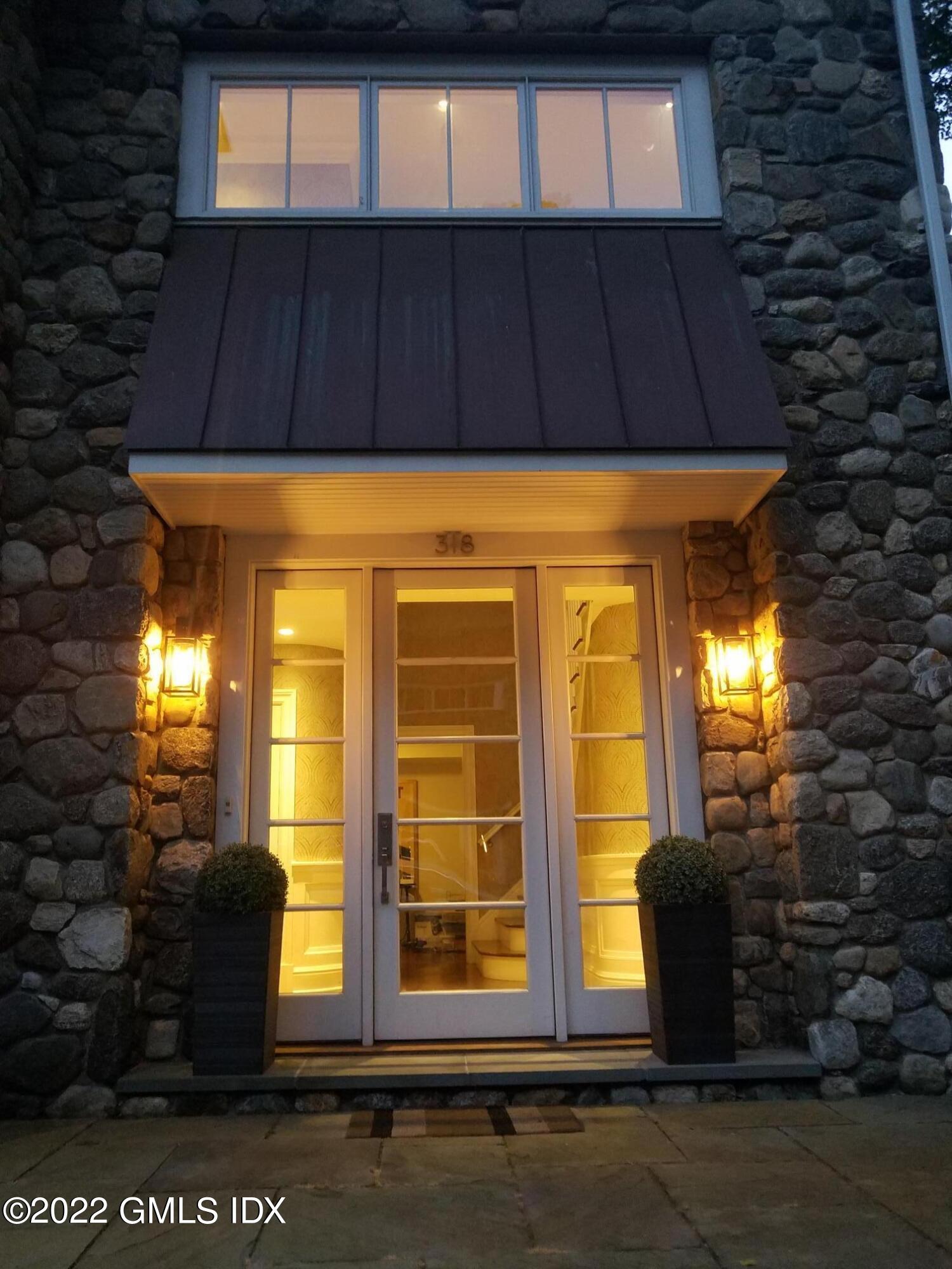 318 Valley Road Cos Cob, CT 06807 - Photo 2 of 33 a view of a house with a door
