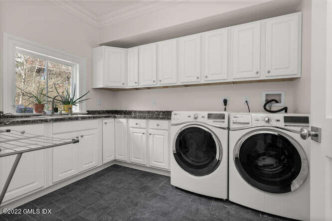 318 Valley Road Cos Cob, CT 06807 - Photo 24 of 33 a utility room with sink dryer and washer