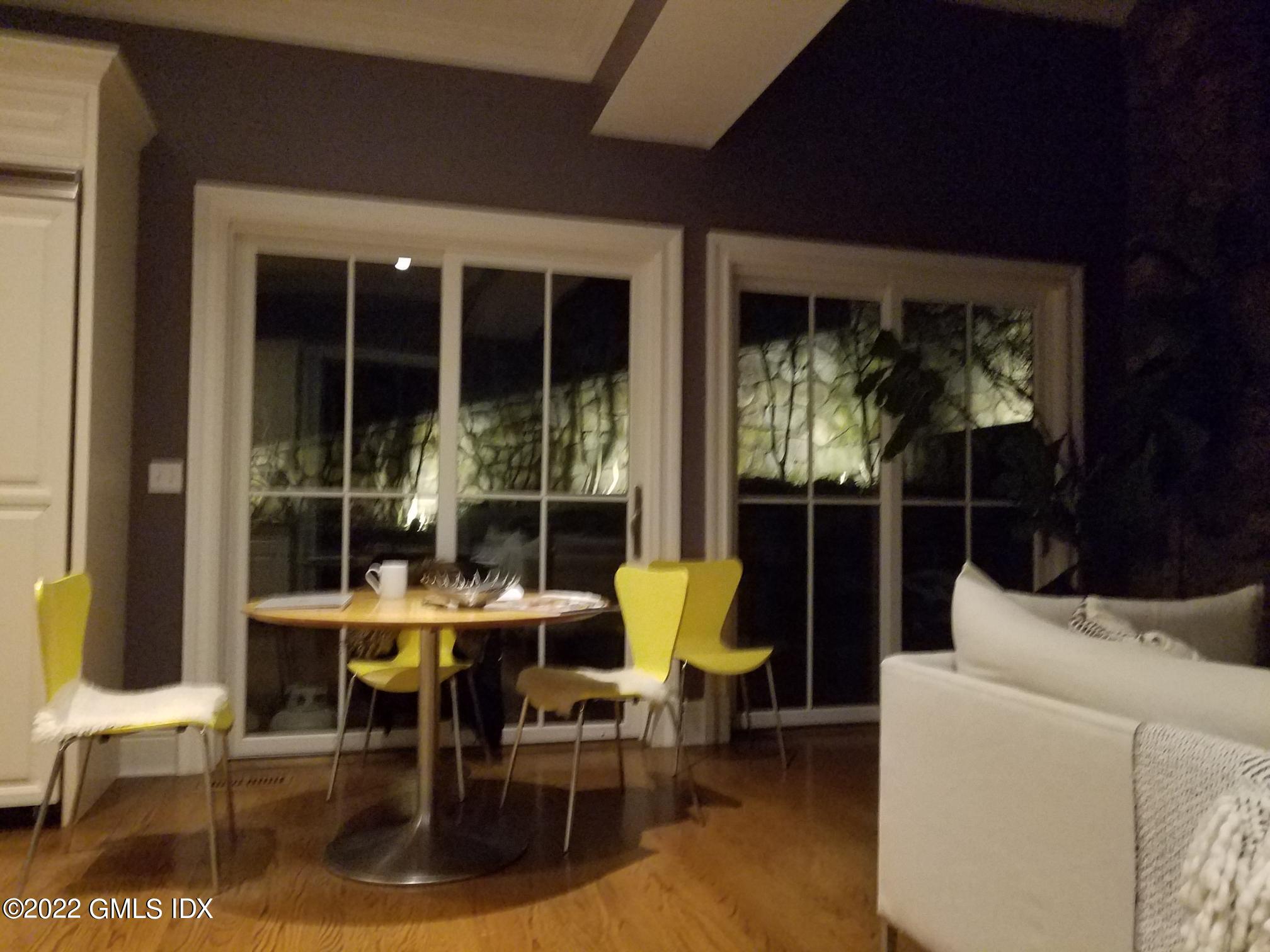 318 Valley Road Cos Cob, CT 06807 - Photo 26 of 33 a view of a dining room with furniture window and outside view