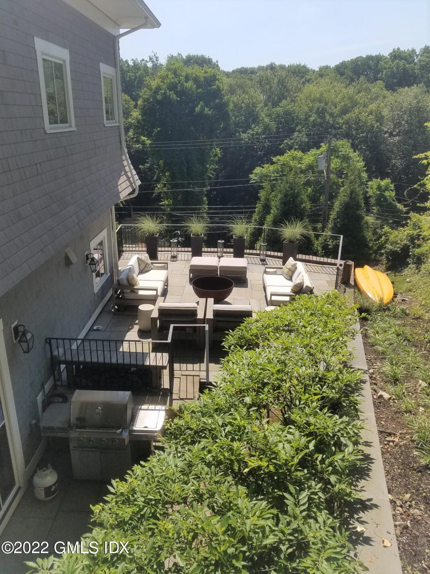 318 Valley Road Cos Cob, CT 06807 - Photo 29 of 33 a view of a chairs and table in a patio