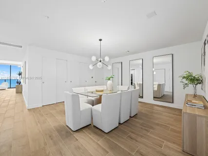 a spacious bedroom with a large bed and a flat screen tv